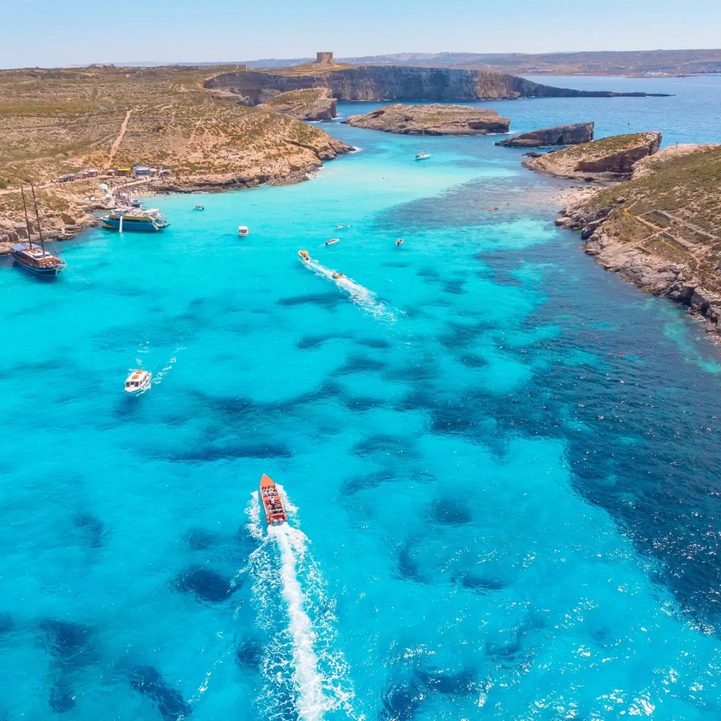 Boats in the Blue Lagoon during Blue Lagoon boat tours in Malta